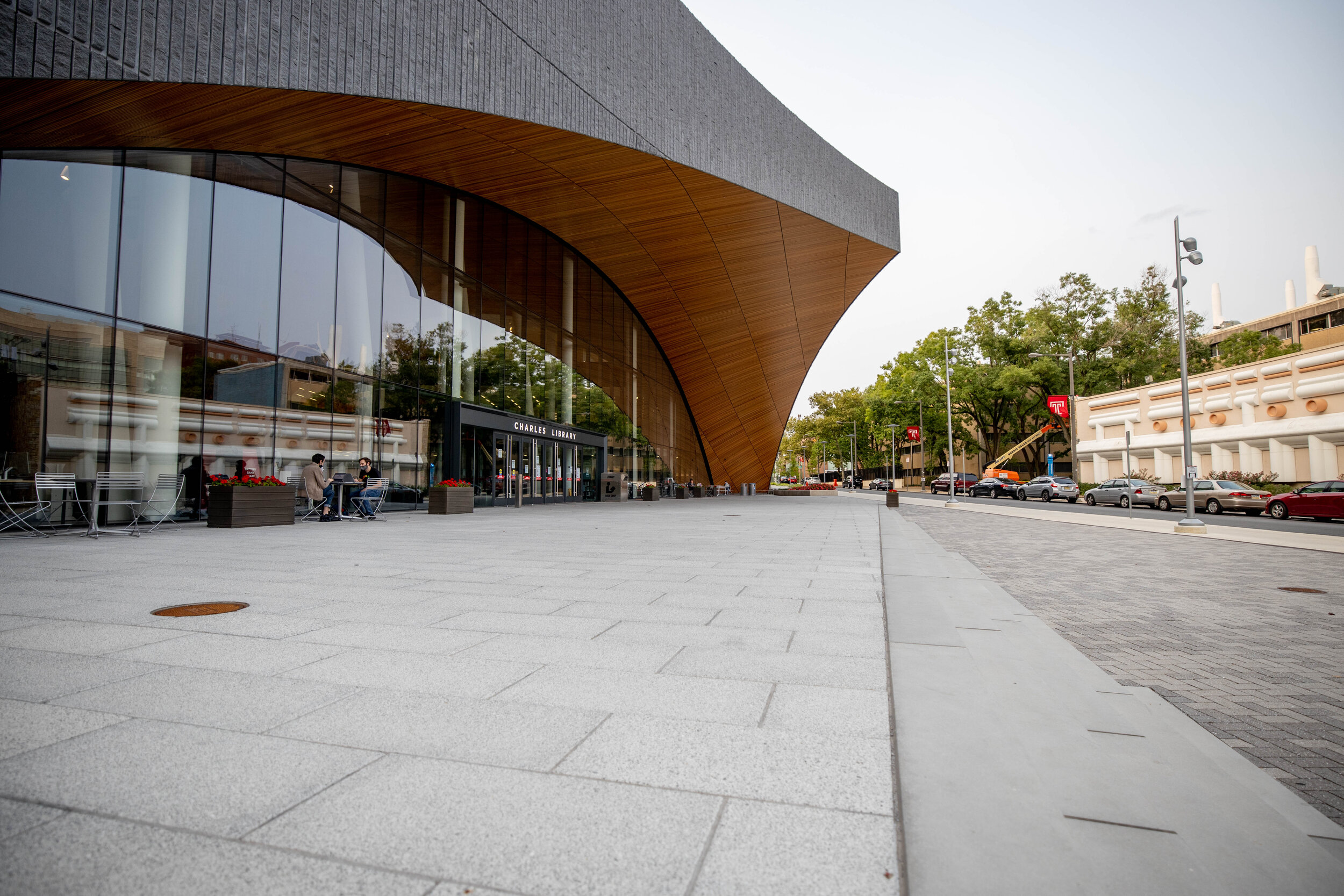 An empty sidewalk in front of the Charles Library at Temple University. Photography by Wolfgang Schwan.