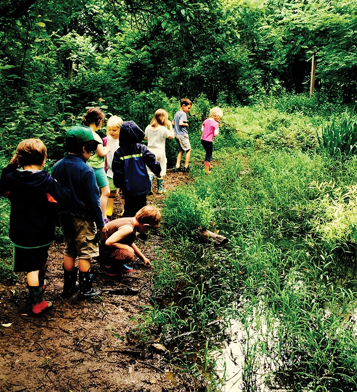 Elementary students at the Schuylkill Center for Environmental Education get down in the mud during a hike |&nbsp;photo by Rebecca Dhondt&nbsp;&nbsp;