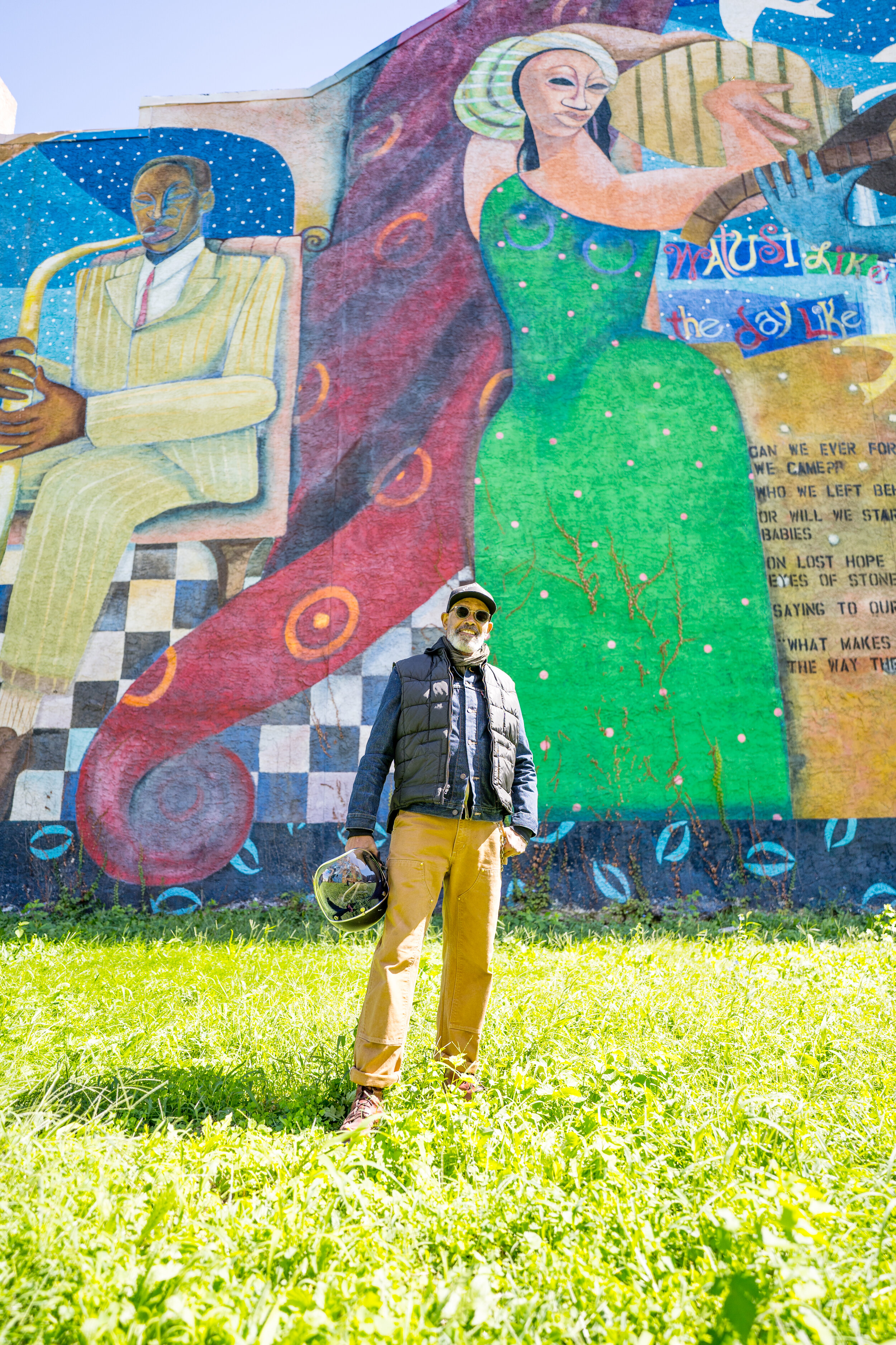 Parris Stancell stands in front of his mural, “The Healing Power of Music.” Photographs by Drew Dennis.