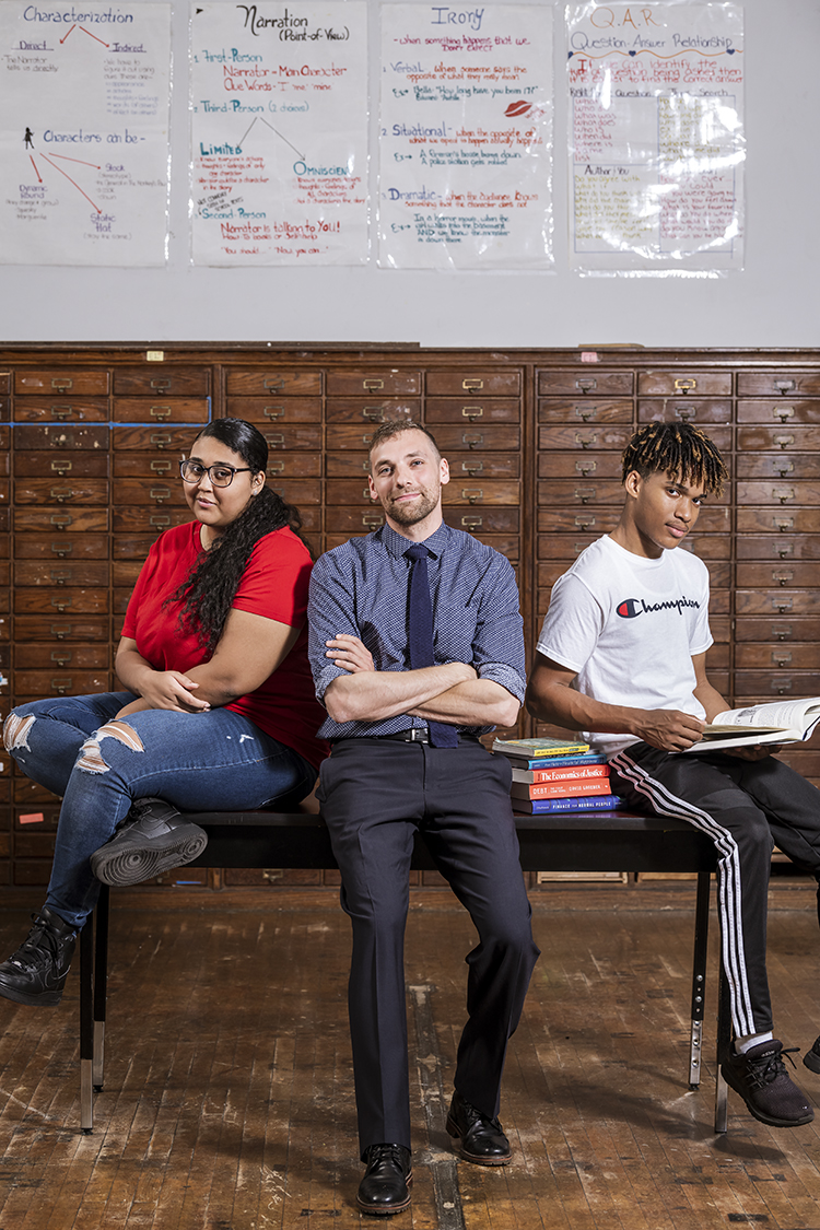  Olney Charter teacher Dan LaSalle (center) is the founder of the Philly Finance Cooperative. This program has helped high school students like Pebbles Ladriye (left) and Bryant Alvarado (right) develop lifelong money management skills. (Photo by Lin