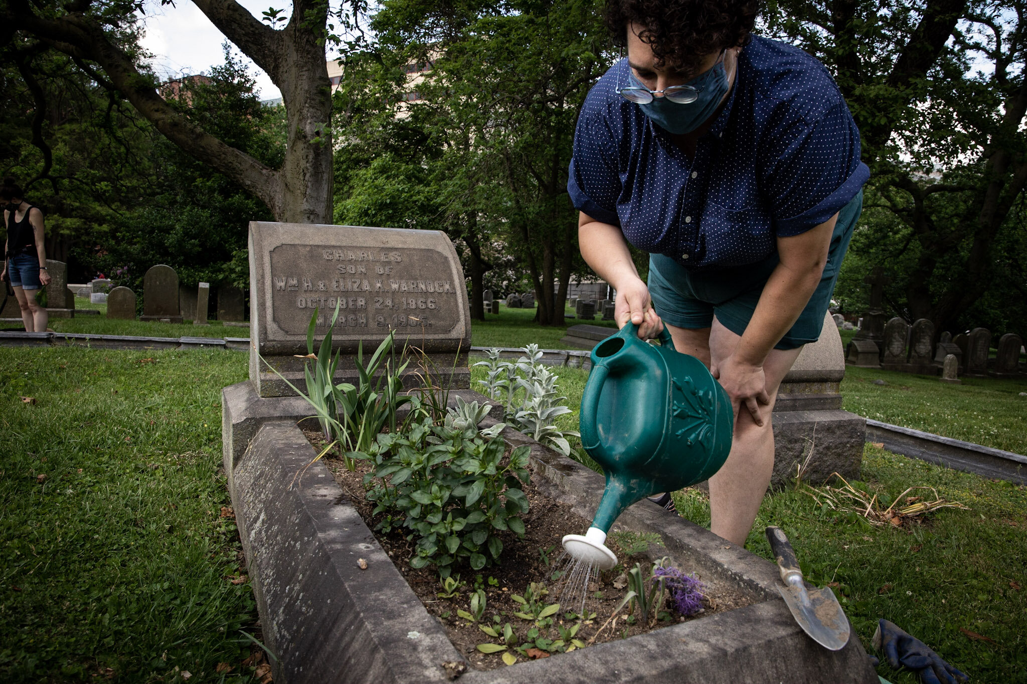 A volunteer Grave Gardener at The Woodlands
