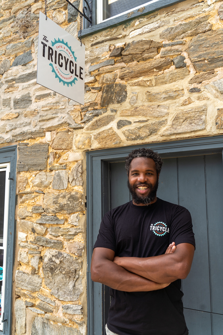 Michael Brown, co-owner of The Tricycle Shop, outside the storefront. Photography by Milton Lindsay.