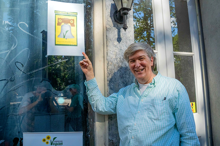 Vance Lehmkuhl, of the American Vegan Society,&nbsp;shows off the organization’s American Vegan Center in Old City at its soft opening event. Photograph by Milton Lindsay.
