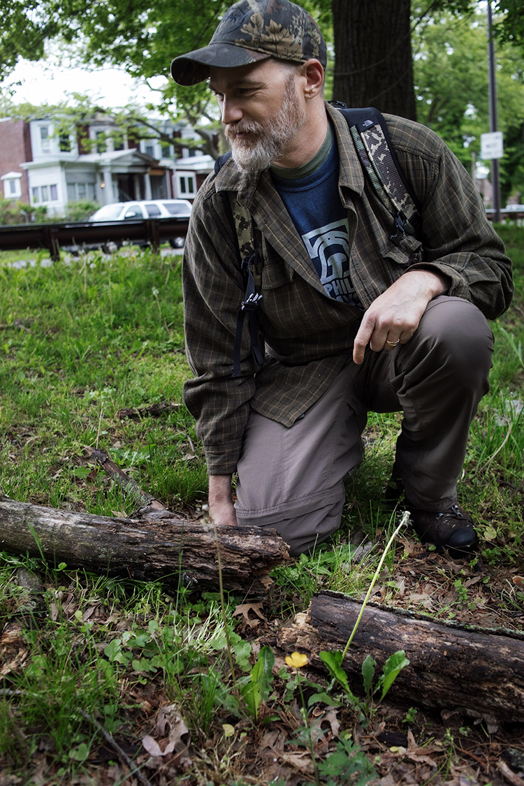 Luke Smithson hunts for mushrooms&nbsp; from Charles McIlvaine’s book “One Thousand American Fungi” along Cobbs Creek. &nbsp;Photography by Rachael Warriner.
