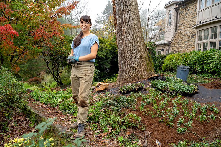 woman standing in landscaped bed