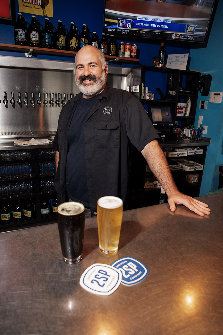 Mike Contreras is the director of sales and marketing at 2SP Brewing Company. The Aston Township brewery is a member of the Brewers for the Delaware Association, which advocates for the health of the watershed. Photography by Rachael Warriner.