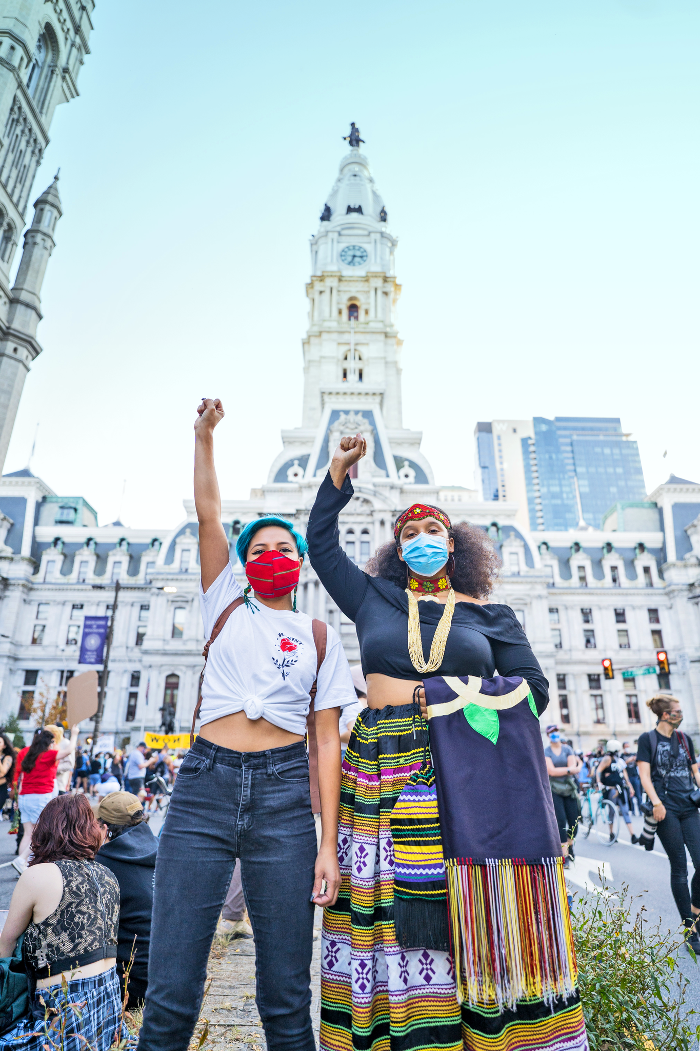 From left: Cindy M. Ngo and Cheyanne L. Elam celebrate the results of the 2020 presidential election in front of City Hall. Photography by Drew Dennis.