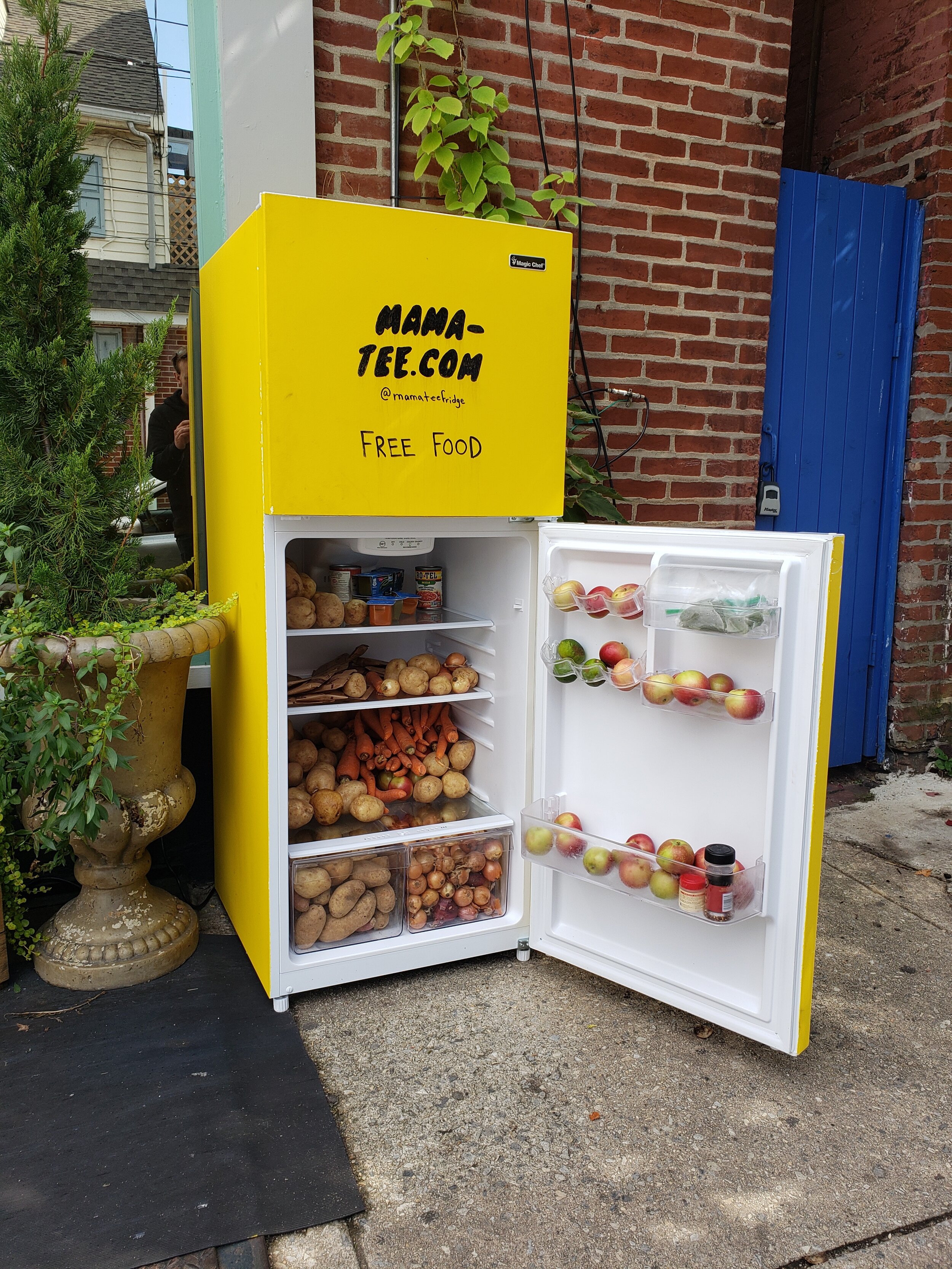 community fridge open to display produce inside
