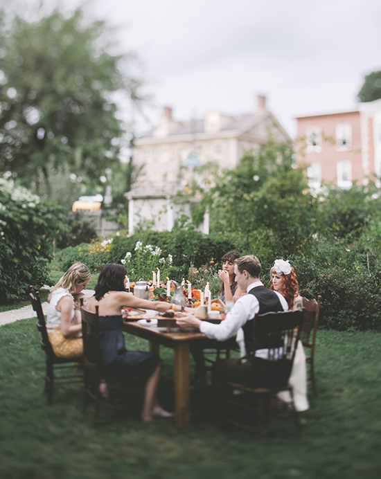Photo by Love Me Do Photography | Sarah Keel and Thom Berg sit down with friends to a meal by Birchtree Catering at the Wyck House.