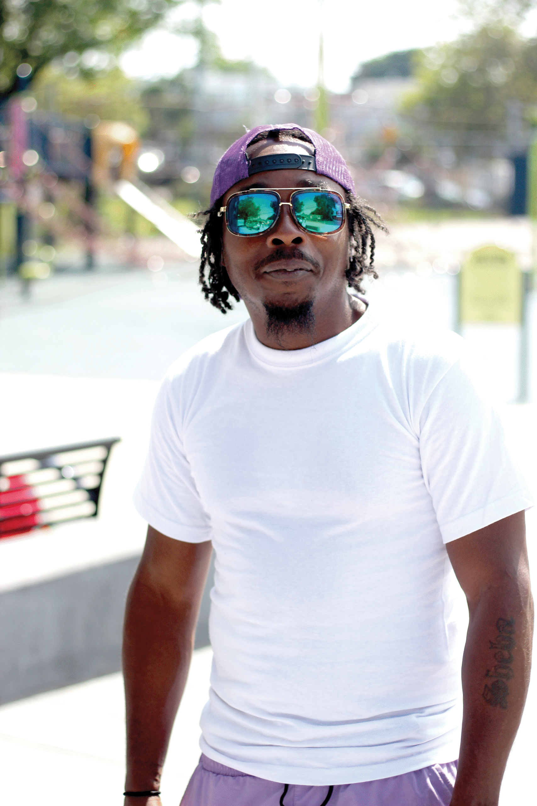 Born and raised in the neighborhood, Sam Davis brought his 13-year-old son to the pool today to beat the heat. But he has his own counterintuitive method for staying cool: boxing. On hot days, he trains outside across the street from Fletcher Pool. “The heat expands your lungs,” he says. 