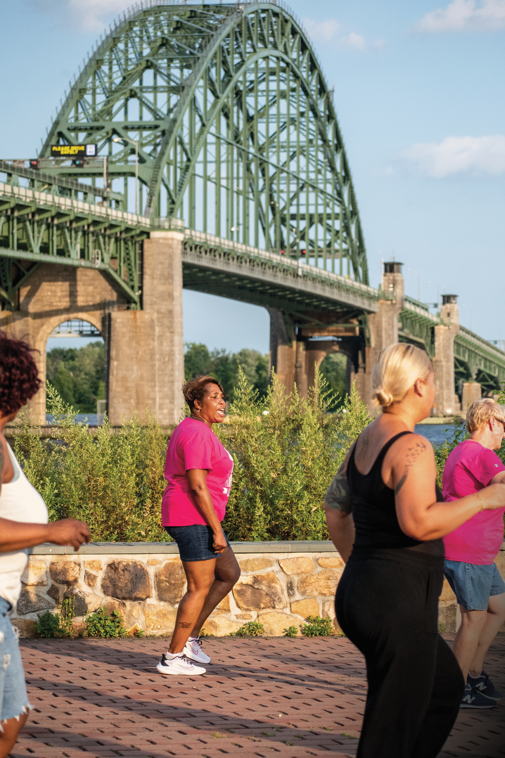 Monique Burrell gets line dancers moving at Lardner’s Point Park. 